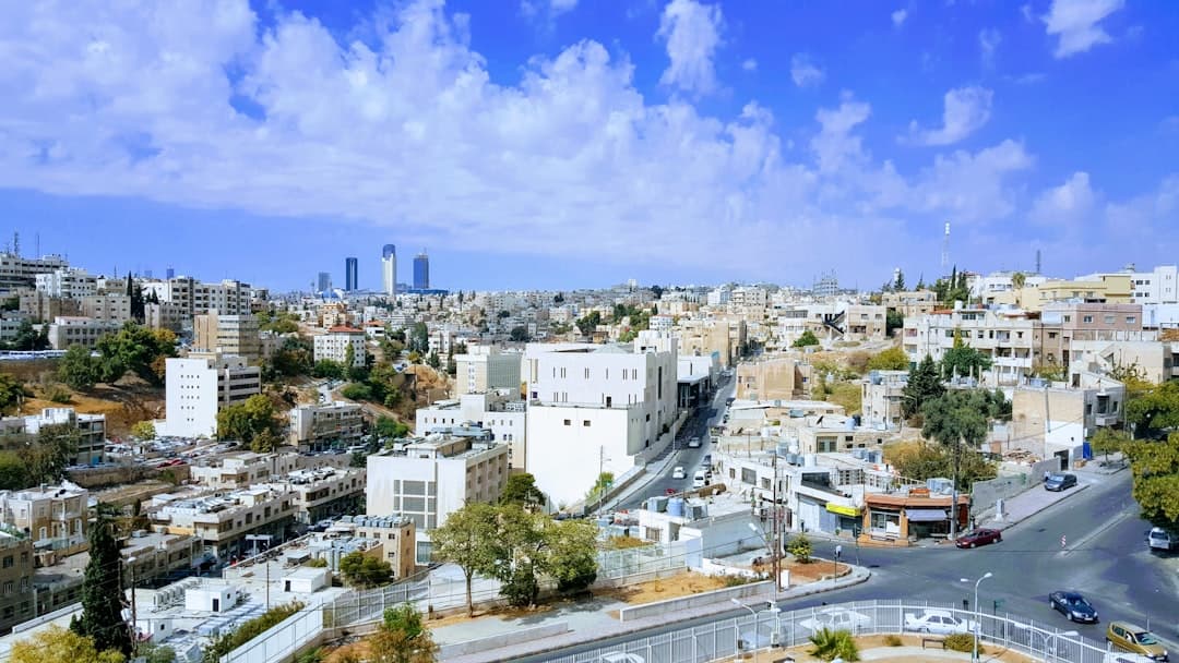 Spice and produce stalls crowding a narrow street in downtown Amman