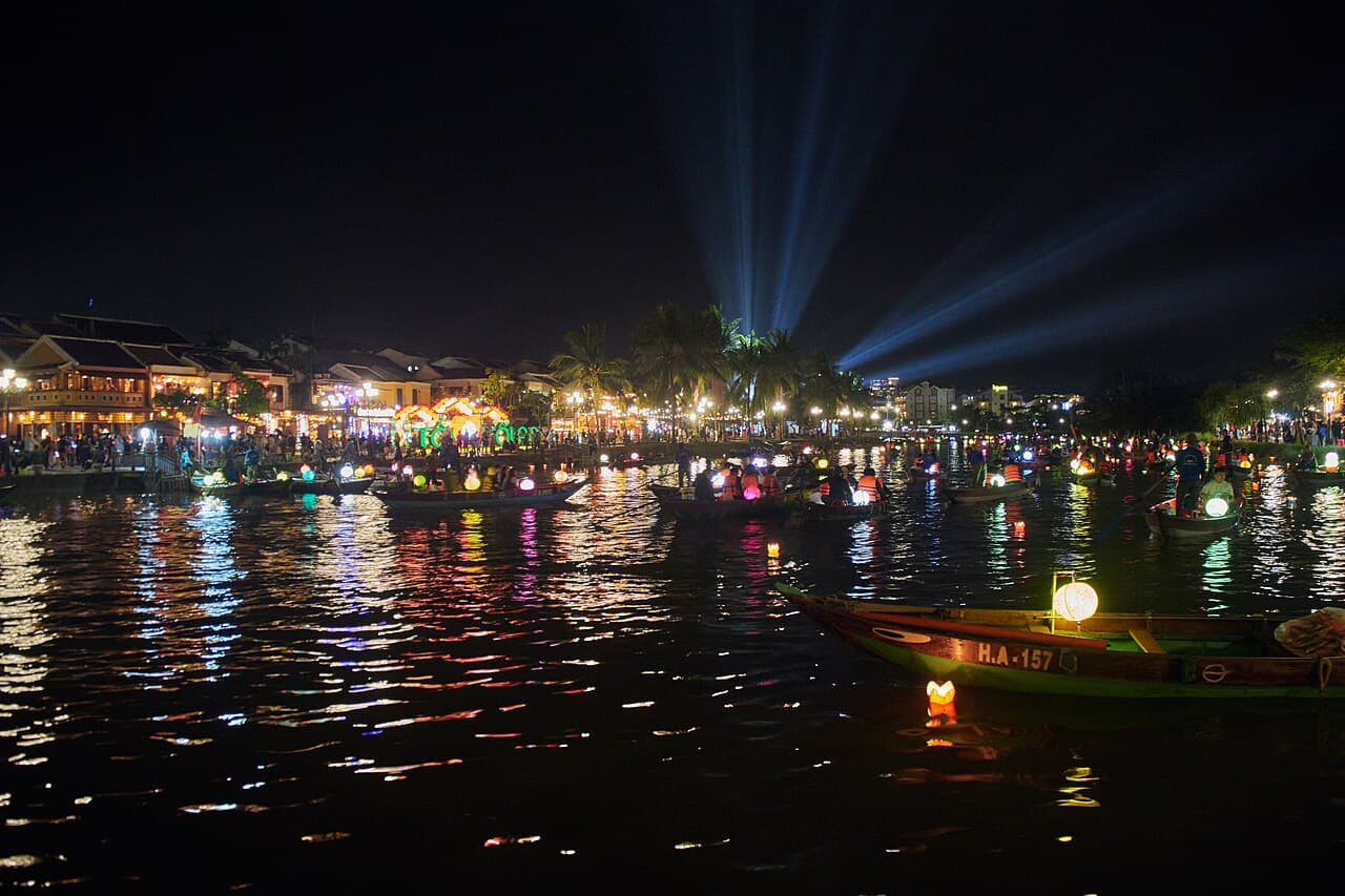 A sampan and floating lanterns on the river, Hoi An