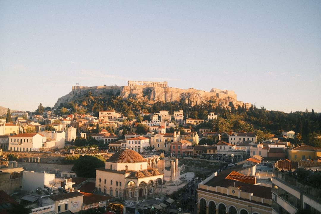 View from Lycabettus Hill over the whole of Athens at dusk, the Acropolis lit below