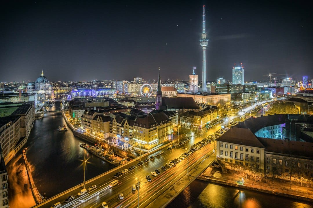 The glass towers and lights of Potsdamer Platz in Berlin at night