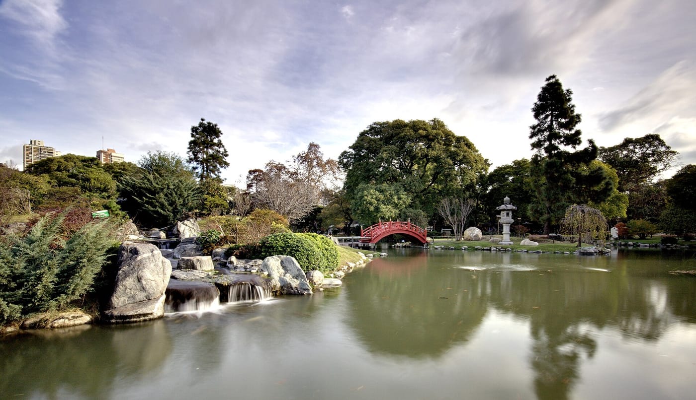 A red bridge over the koi pond in the Jardín Japonés of Buenos Aires