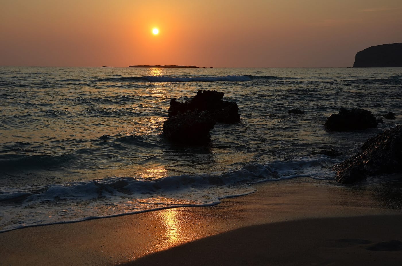 Sunset over the golden sand of Falassarna beach in Crete