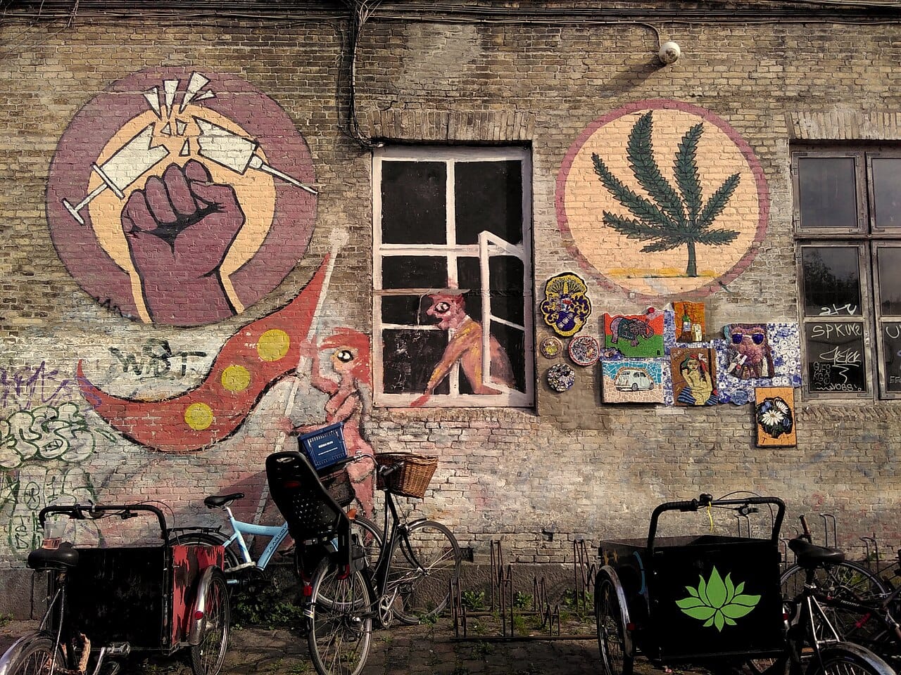 A mural-covered lane in Freetown Christiania, Copenhagen