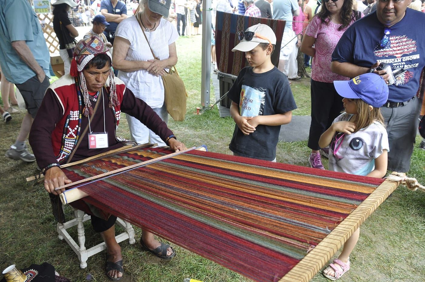 A weaver demonstrating traditional textiles at Chinchero near Cusco