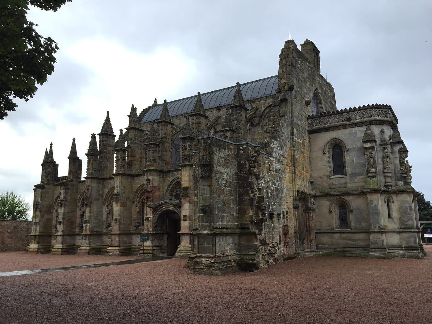 The ornately carved stone exterior of Rosslyn Chapel near Edinburgh