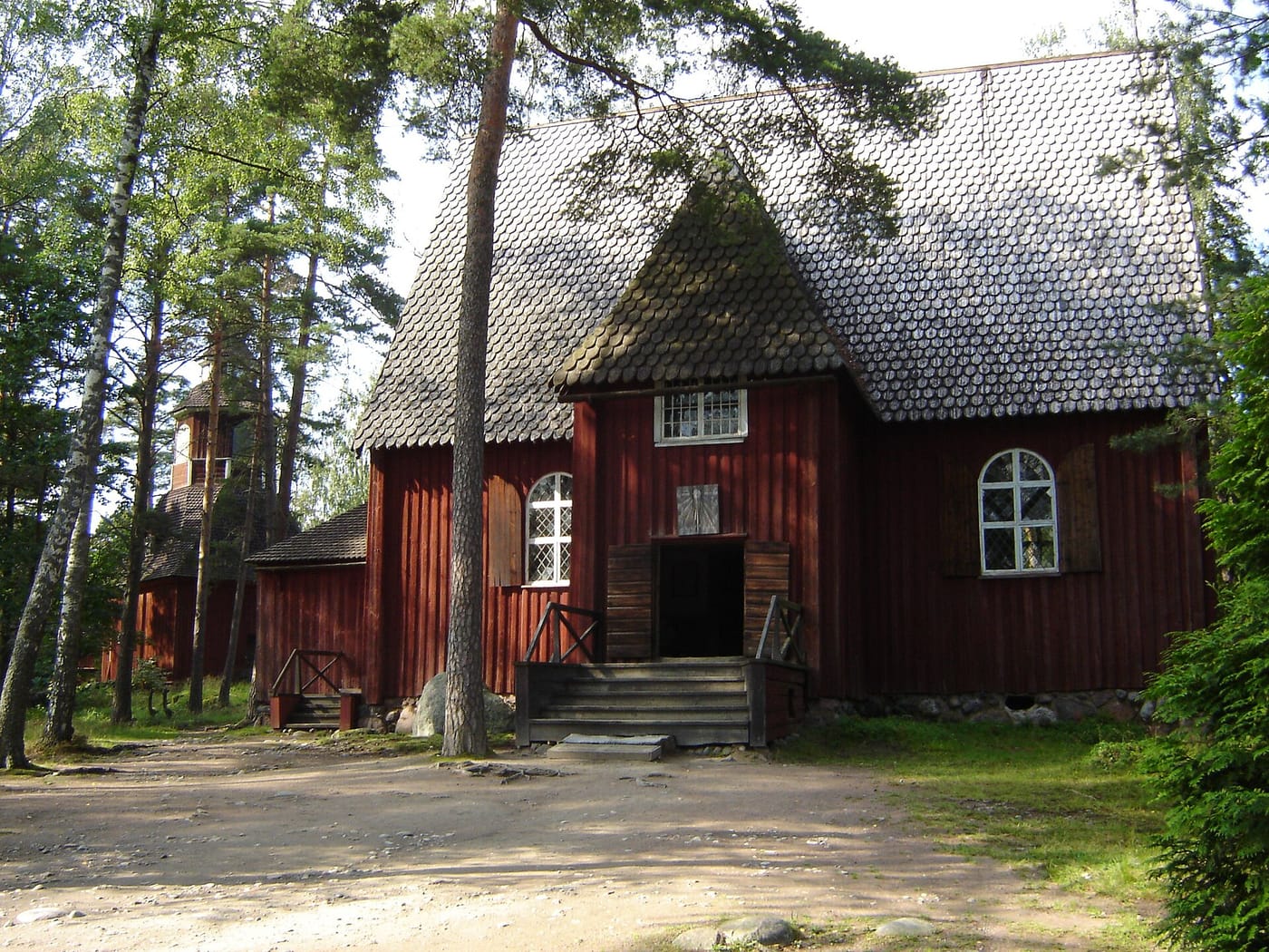 An old red wooden church at the Seurasaari open-air museum in Helsinki