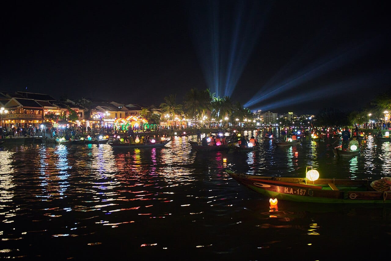 A sampan and floating lanterns on the river, Hoi An