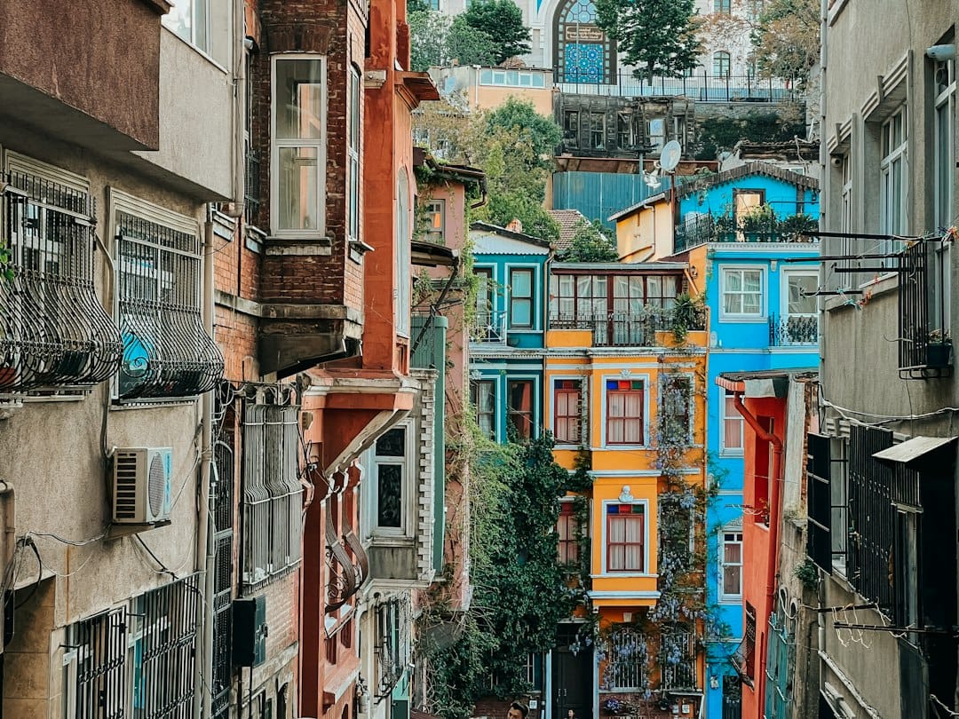 Brightly painted terraced houses climbing a hill in Balat, Istanbul