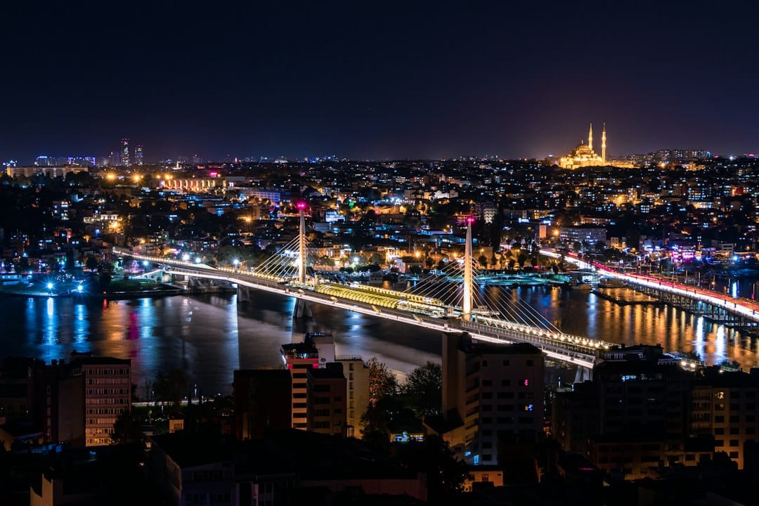 The Galata Bridge and Istanbul skyline lit up at night