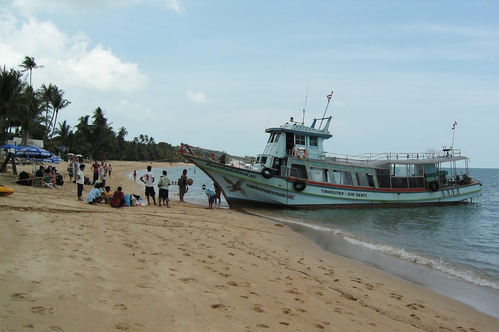 A longtail boat on a beach on Koh Phangan near Koh Samui