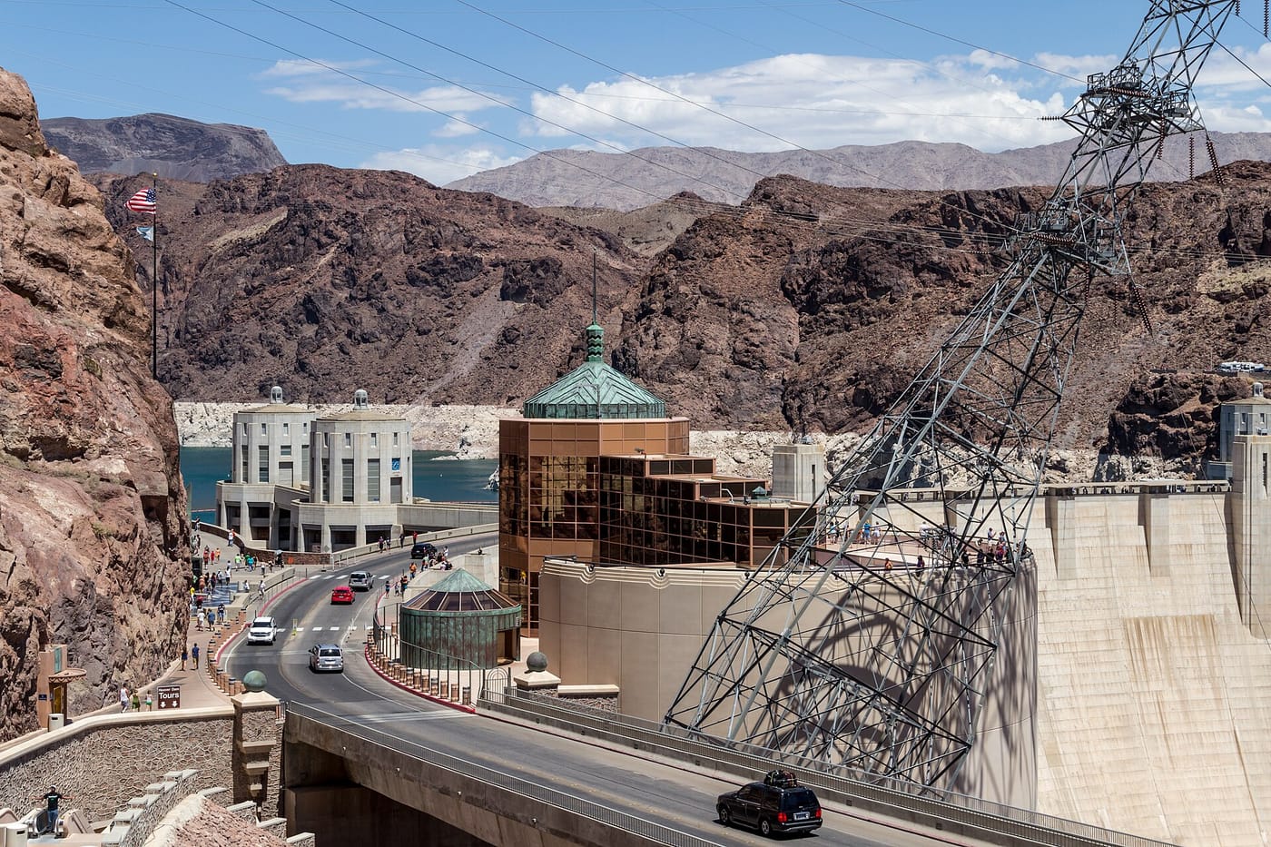The curved wall of the Hoover Dam in the desert canyon