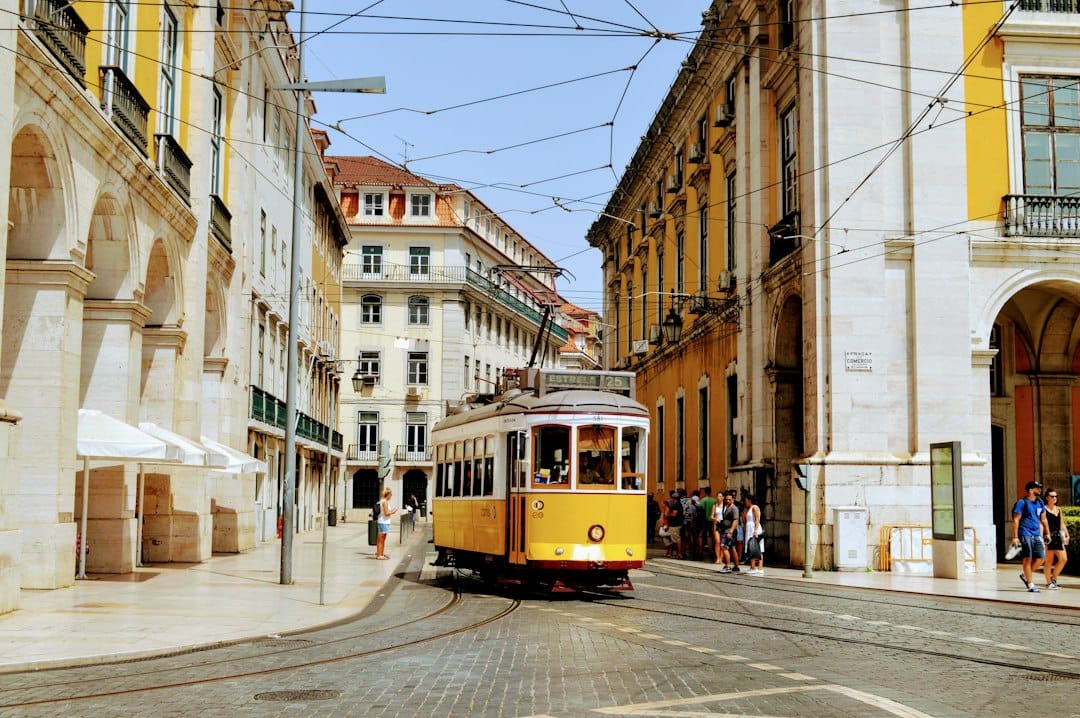 The yellow Bica funicular climbing a steep Lisbon street