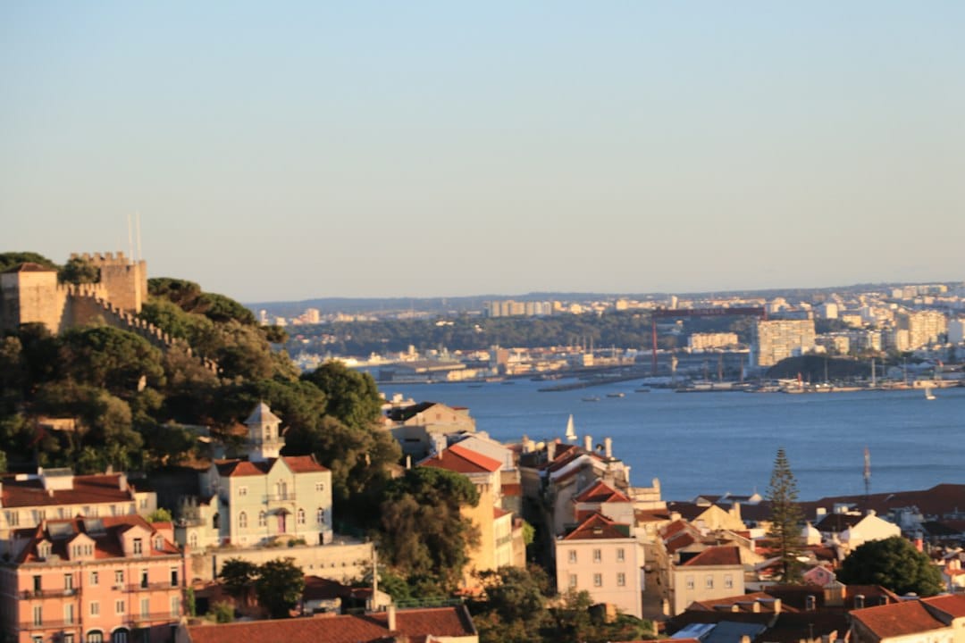 View over Lisbon's rooftops and the Tagus from São Jorge Castle ramparts