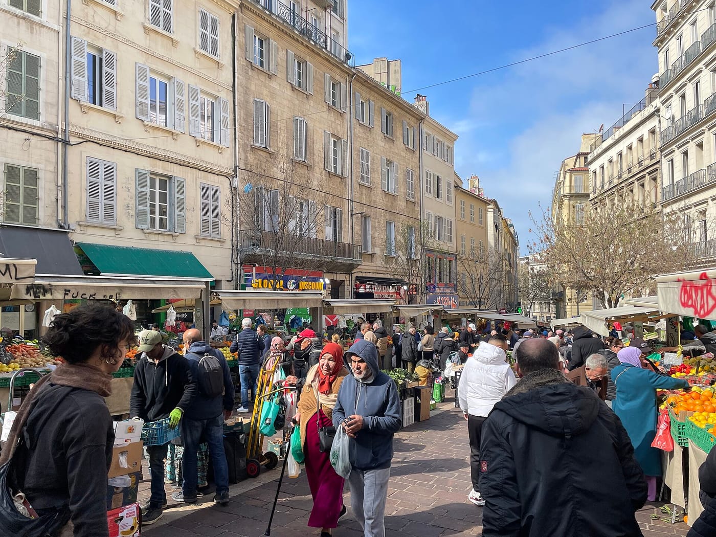 Stalls and shoppers at the Noailles market in Marseille