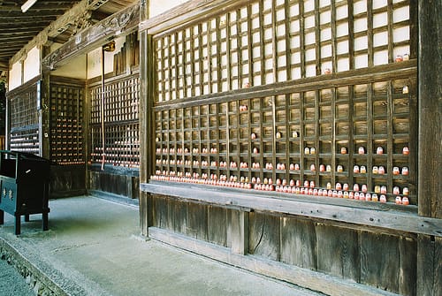 Rows of small red Daruma dolls at Katsuo-ji temple near Osaka