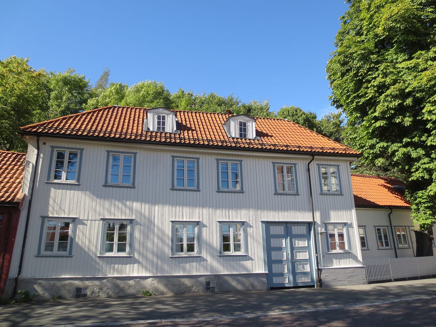 Old wooden houses on the cobbled lane of Damstredet in Oslo