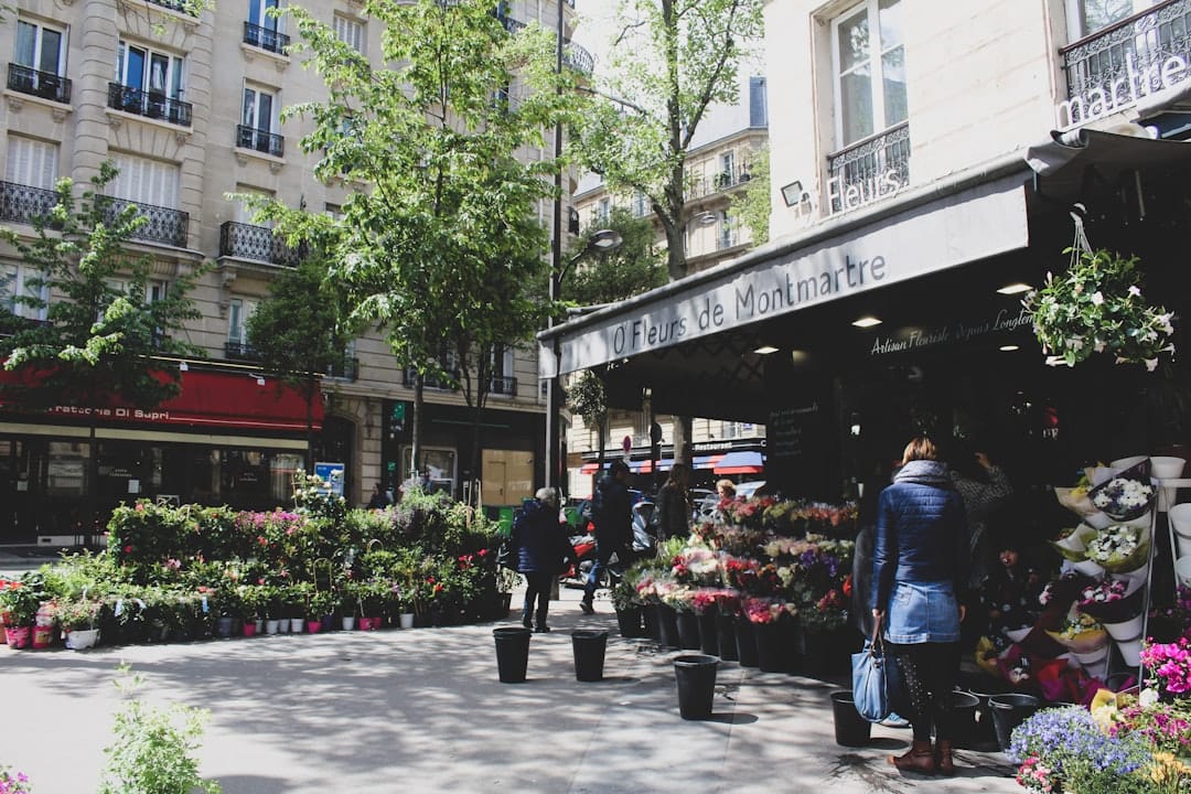 Flower and produce stalls lining the open-air Marché d'Aligre in Paris