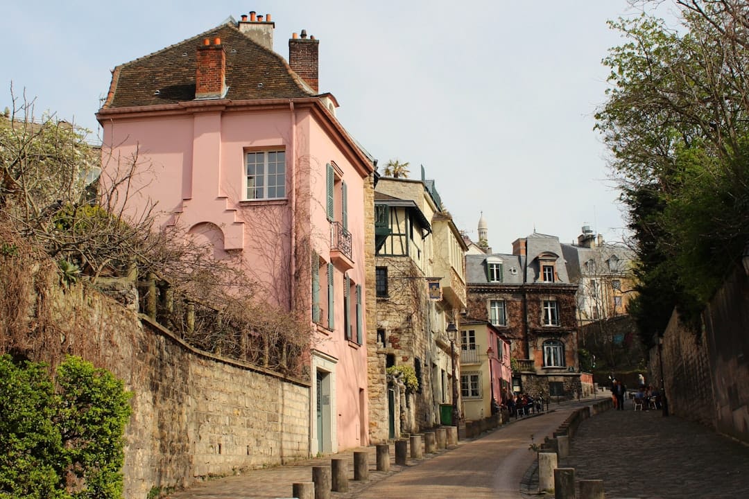 Empty steep steps and lampposts climbing to Sacré-Cœur in early light