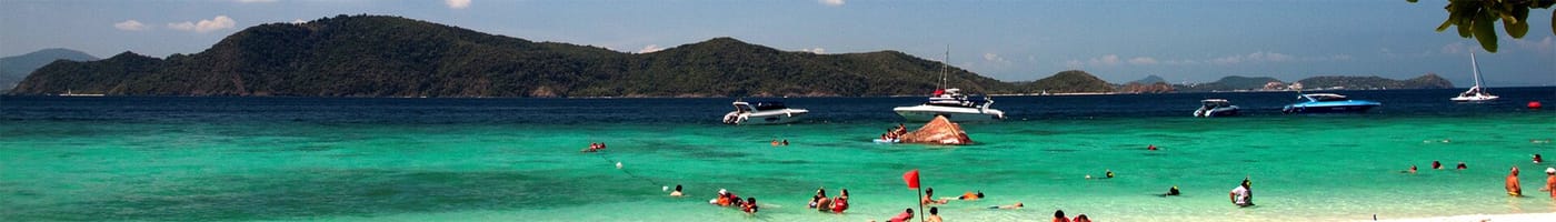 Clear turquoise water and a boat off Coral Island near Phuket