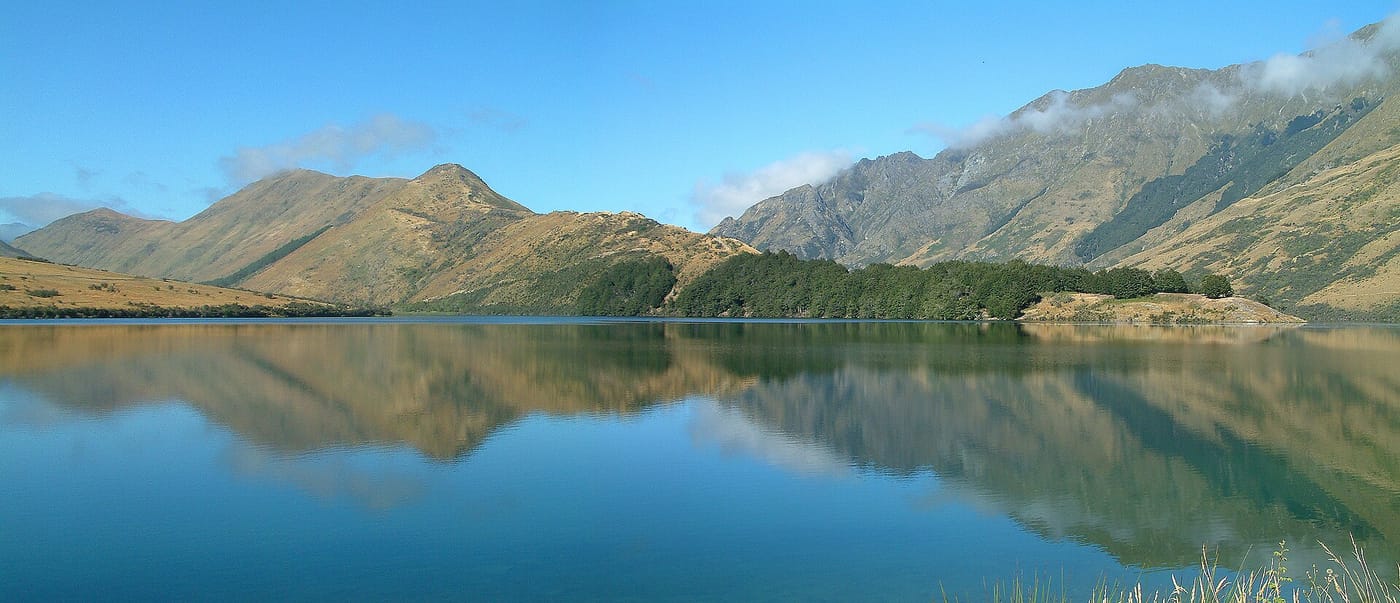 The mirror-still Moke Lake ringed by mountains near Queenstown