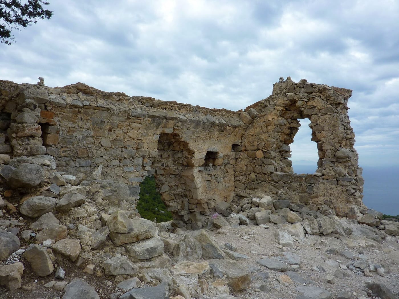 The ruined Monolithos Castle on its rock pinnacle in Rhodes