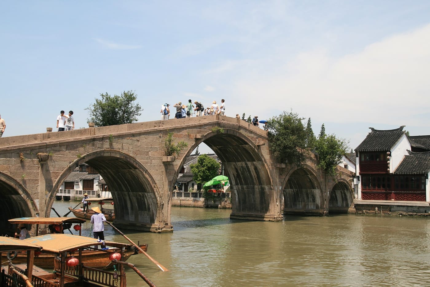 An arched stone bridge over a canal in the Zhujiajiao water town near Shanghai
