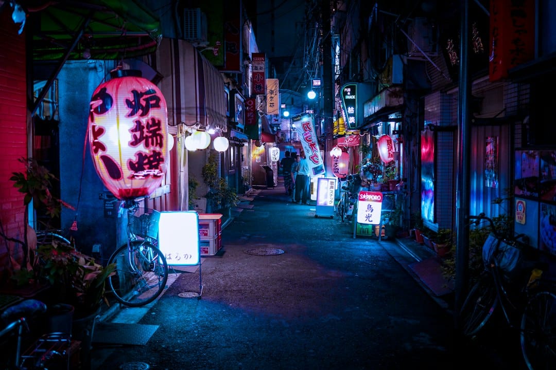 A neon-lit backstreet with paper lanterns in Akihabara, Tokyo